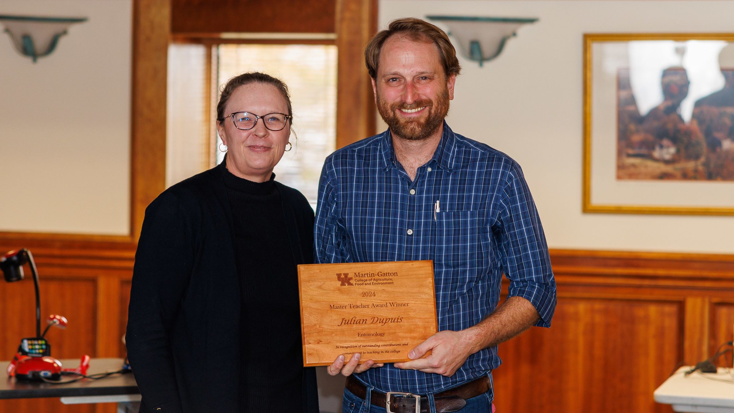 Carmen Agouridis (pictured right), senior associate dean of student success, presented the Master Teacher Award to Julian Dupuis (pictured right). Photo by Matt Barton.